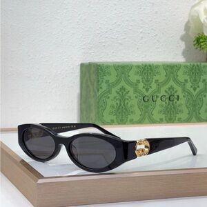Gucci Black Cat-Eye Sunglasses with Gold Accents